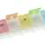 7-day pill organizer with color-coded compartments, close-up of compartments