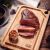 Tramontina Churrasco Teak Cutting Board with Grilled Meat and Garlic