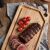 Tramontina Churrasco Teak Cutting Board with Roasted Meat and Tomatoes