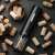 Adler Electric Wine Opener with Corks on Dark Background