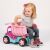 Little girl playing with Wader Pink Dump Truck Toy