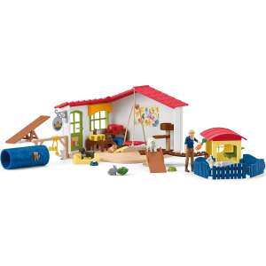 Schleich Farm World Animal Hotel playset with a house, a fence, a swing, a slide, a tunnel, a seesaw, a dog run, a cat tree, and figures - Schleich