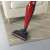 Ariete 2765 Evo cordless stick vacuum cleaner cleaning a carpet