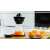 Bosch VitaStyle Citro electric citrus juicer with glass jug and orange juice, on kitchen counter