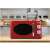 Girmi FM21RED red retro microwave oven in a kitchen setting