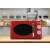 Girmi FM21RED red retro microwave oven in a kitchen setting