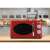 Girmi FM21RED red retro microwave oven in a kitchen setting