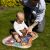 Mother and baby playing on BabyOno Coral Reef water play mat outdoors