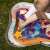 Baby playing on the BabyOno Coral Reef Inflatable Water Play Mat