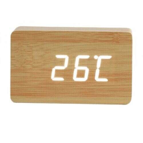Light brown wooden digital alarm clock with white LED display showing the time and temperature