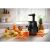 Tefal Juiceo ZC150838 slow juicer in use with fresh fruits and vegetables