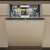 Whirlpool W8I HT58 TS built-in dishwasher, closed door, beige color, front view