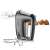 Severin HM3832 hand mixer with beaters attached, angled view, muffins in the background