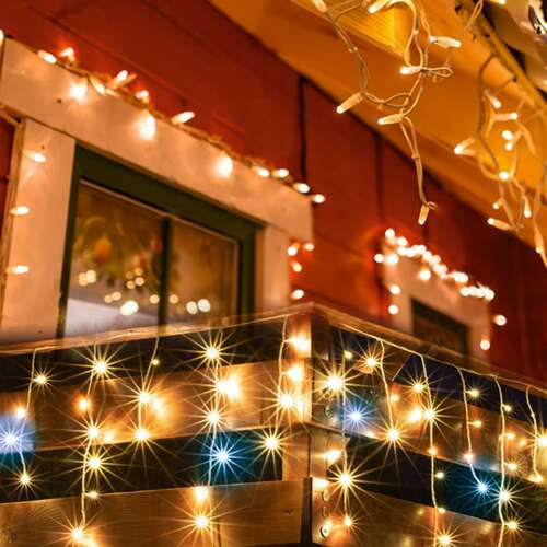 LED icicle string lights decorating a house for Christmas