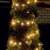 Home by Somogyi LED208C/WW LED string lights decorating a bush