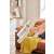 Dreame VPV20A U10 cordless stick vacuum cleaner, white and black, being used to clean a sofa