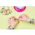 Child making bracelets with Cool Maker Pop Style kit