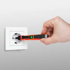 Maxwell MV-25 822 voltage detector pen being used to test a wall outlet - Maxwell