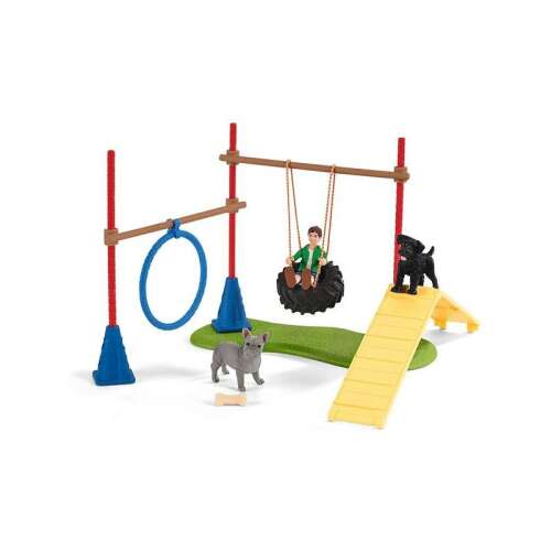 Schleich Farm World Dog Agility Course Playset with boy, two dogs, jump, tire swing, and ramp