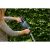 Woman using Gardena ComfortCut 50/18V cordless hedge trimmer