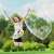 Child jumping in the air with a giant soap bubble