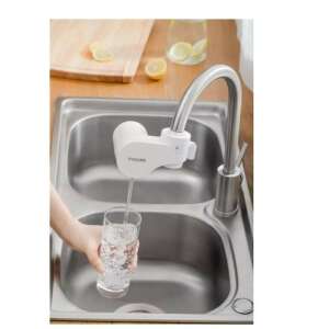 Philips AWP3754/10 X-Guard water filter, white, installed on a kitchen faucet, pouring filtered water into a glass - Water Filter Pitcher and Accessory