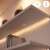 WiZ LED strip installed under a shelf, providing ambient lighting, smart home control