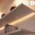 WiZ LED strip installed under a shelf, providing ambient lighting, smart home control
