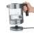 Graef WK300 1 L 2000 W electric kettle with glass body and stainless steel base, showing the kettle disassembled