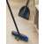 York Partvis 120cm broom and dustpan set in use, sweeping leaves on a wooden floor
