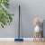 York Partvis 120cm broom with handle, blue bristles, 33x10cm head, in a living room setting