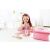 Little girl playing with Hape Beauty Belongings wooden makeup set