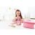 Little girl playing with Hape Beauty Belongings wooden makeup set