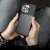 iPhone 13 Pro black TPU case in hand, close up view