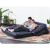 Couple relaxing on Bestway inflatable sofa bed in bed configuration