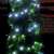 LED string lights decorating a Christmas tree, 100 cool white LED lights, 7 meter long, green wire