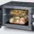 Severin MW 7762 black microwave oven with grill function, open door, food inside