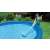 Woman cleaning inflatable pool with Intex cleaning set