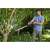 Man using Gardena SlimCut Pruning Lopper to prune branches