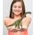 Child holding Schleich Brachiosaurus dinosaur figure, green, realistic, detailed, collectible