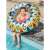 Bestway Flirty Fiesta™ inflatable swim ring, 107 cm, colorful design, girl using it