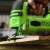 Greenworks GD24JS cordless jigsaw in use, cutting wood