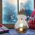 LED illuminated ceramic snowman Christmas decoration in a home setting