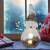 LED illuminated ceramic snowman Christmas decoration in a home setting