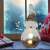 LED illuminated ceramic snowman Christmas decoration in a home setting