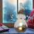 LED illuminated ceramic snowman Christmas decoration in a home setting