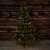 180 cm tall artificial Christmas tree with built-in LED lights, half-tree design, in a rustic setting