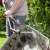 Gardena Comfort watering lance in use, cleaning a wheelbarrow