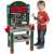 Child playing with Klein Bosch Mini Work Shop toy workbench, green and red workbench with tools