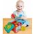 Happy baby playing with Clemmy Sensory Bucket and blocks